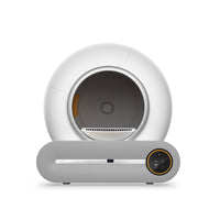 Front view of the white X30 litter box on its gray base, showing the oval entrance