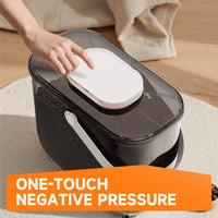 Top view of the Q5 vacuum pet food container with a hand pressing the one-touch button on the lid to seal in freshness